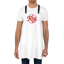 Load image into Gallery viewer, Key Logo Apron — White Kitchen Apron with Red Script Logo